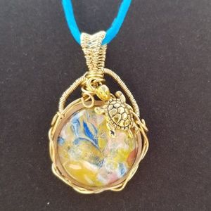 Mixed media pendant with turtle charm